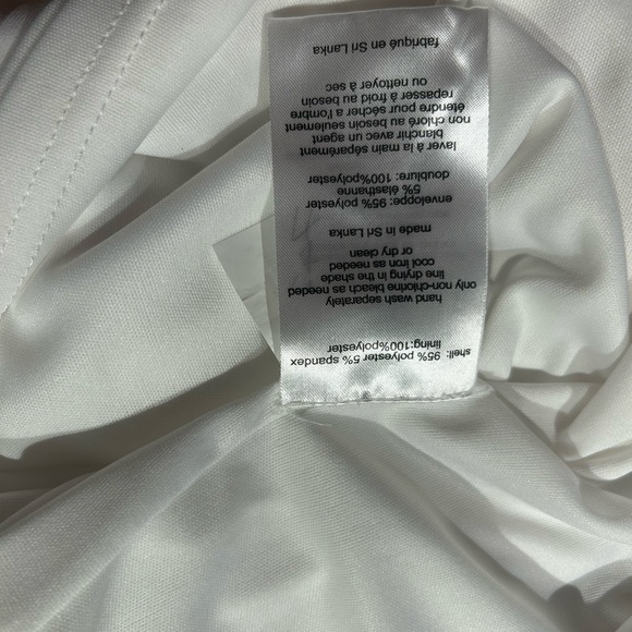 Long sleeve white jersey dress with side draping. NWT Size 12. - Picture 5 of 6